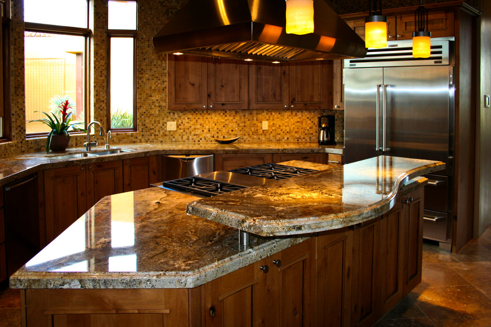 Transitional kitchen photo in Phoenix with granite countertops and an island
