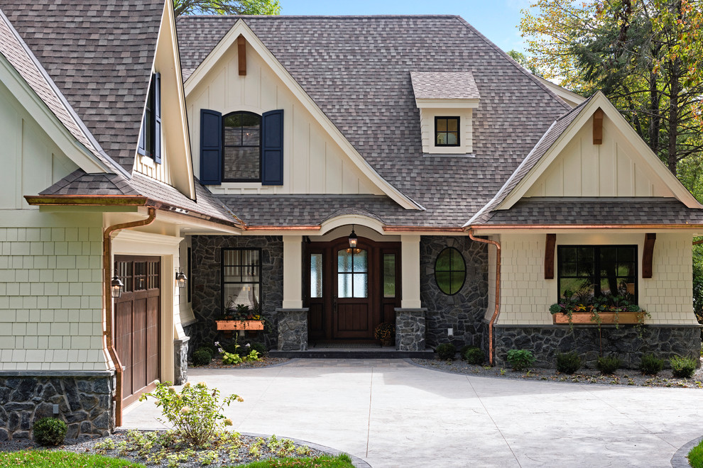 Design ideas for a traditional two-storey exterior in Other with mixed siding.