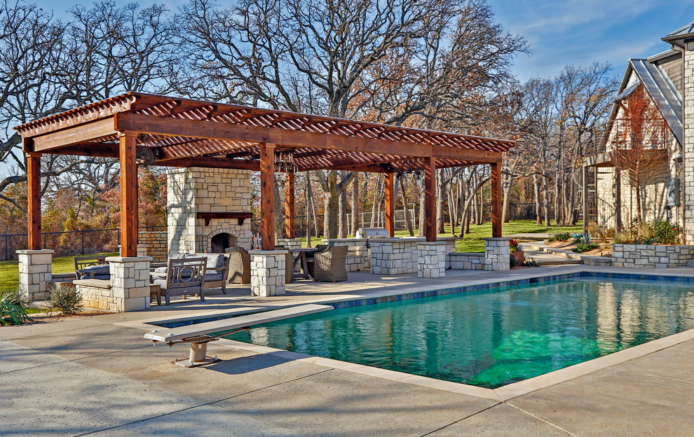 Photo of a mid-sized contemporary backyard rectangular pool in Dallas with concrete slab.