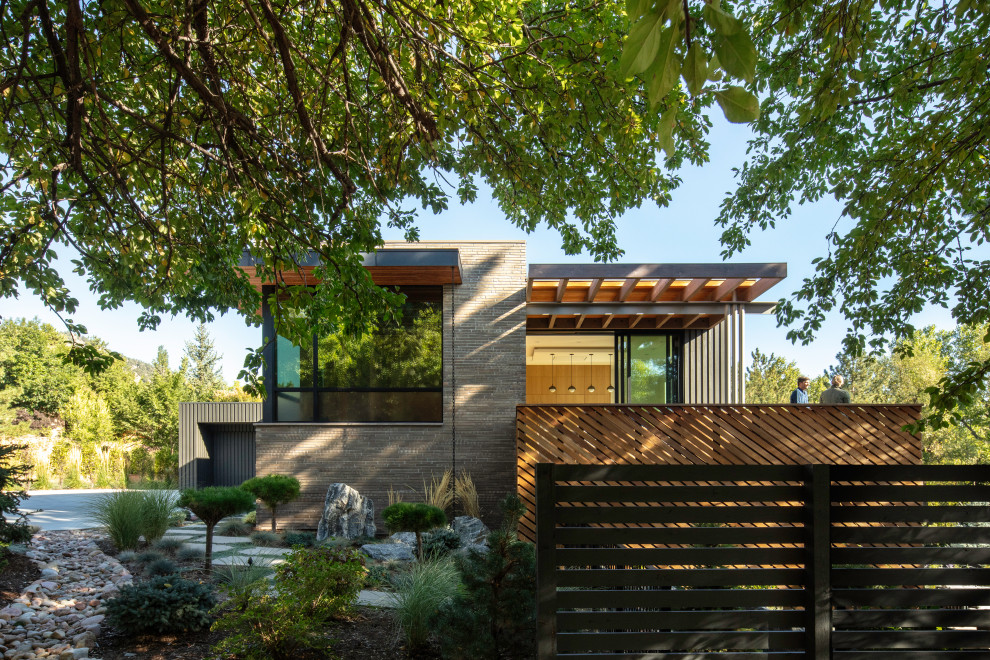 Inspiration for a 1950s two-story brick exterior home remodel in Denver