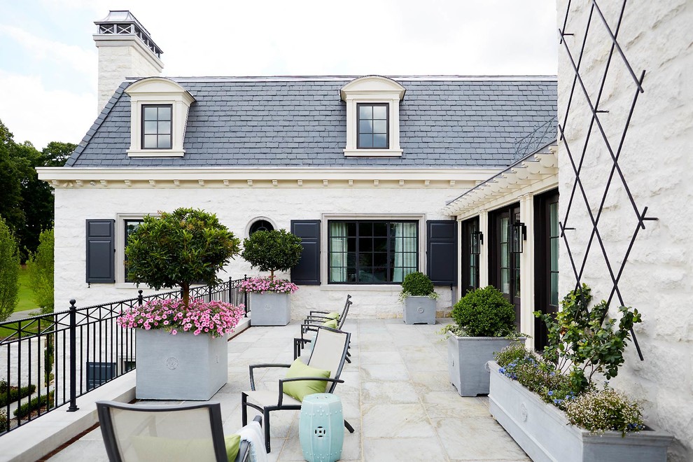 Traditional balcony in Other with a container garden, no cover and metal railing.