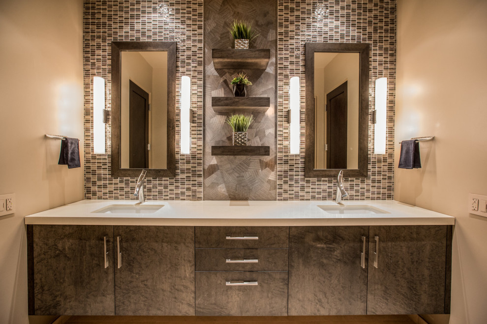 Inspiration for a mid-sized contemporary bathroom in Phoenix with flat-panel cabinets, medium wood cabinets, brown tile, glass sheet wall, beige walls, an undermount sink, engineered quartz benchtops and beige benchtops.