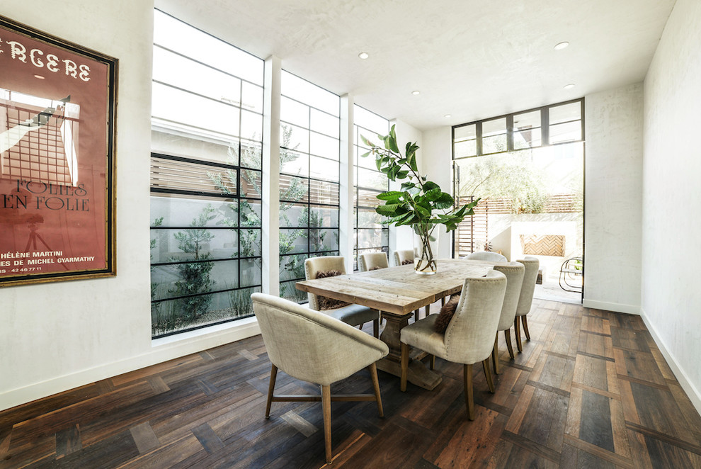 Design ideas for a large open plan dining in Los Angeles with white walls and dark hardwood floors.