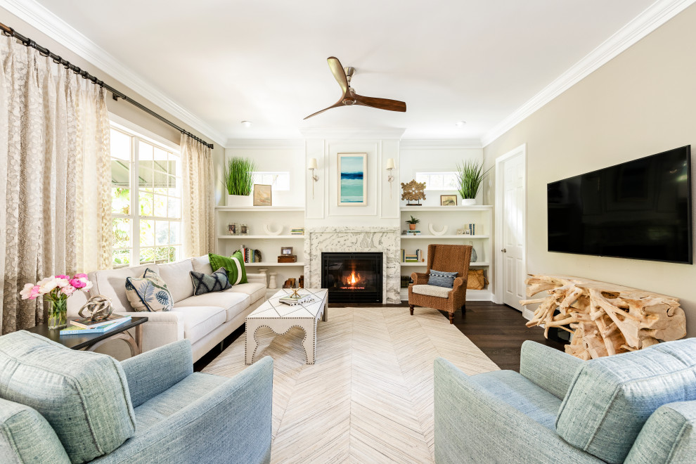 Design ideas for a mid-sized beach style open concept family room in Tampa with beige walls, dark hardwood floors, a standard fireplace, a stone fireplace surround, brown floor and a wall-mounted tv.