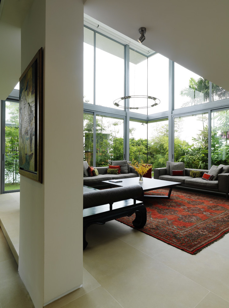 This is an example of a large contemporary living room in Singapore with white walls.