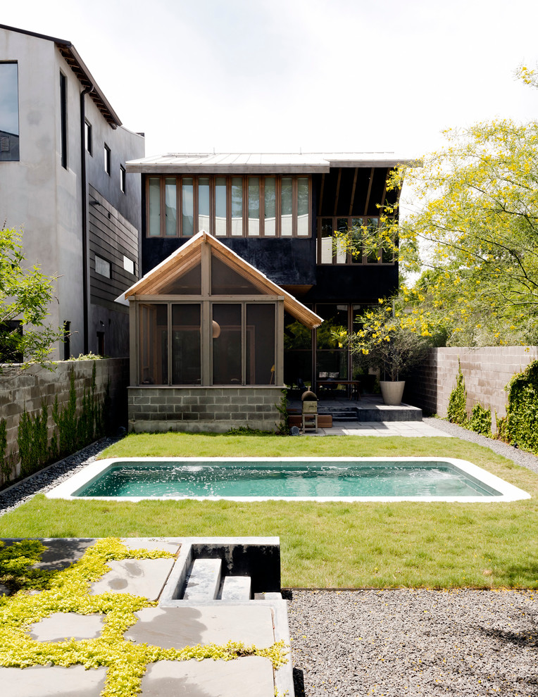 Example of a small trendy backyard mixed siding, concrete and rectangular lap pool design in Houston