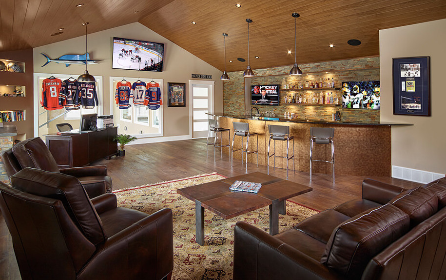 Example of a mountain style home bar design in Calgary