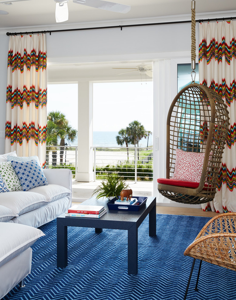 Design ideas for a beach style living room in Jacksonville with white walls.