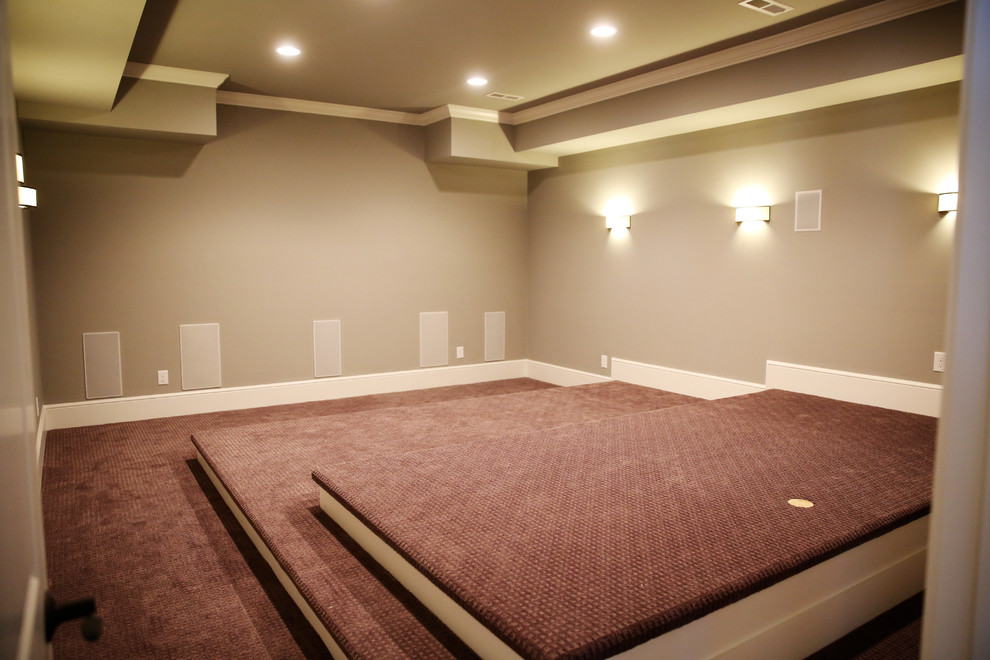 Example of a large classic enclosed carpeted home design design in Charlotte with beige walls and a projector screen