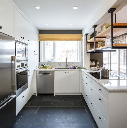 Compact Kitchen Cabinet Mississauga renovation in a U-shaped layout featuring white cabinets, industrial open shelving, and dark tile flooring