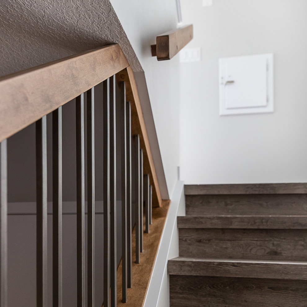 Design ideas for a small traditional acrylic l-shaped staircase in Edmonton with wood risers and mixed railing.