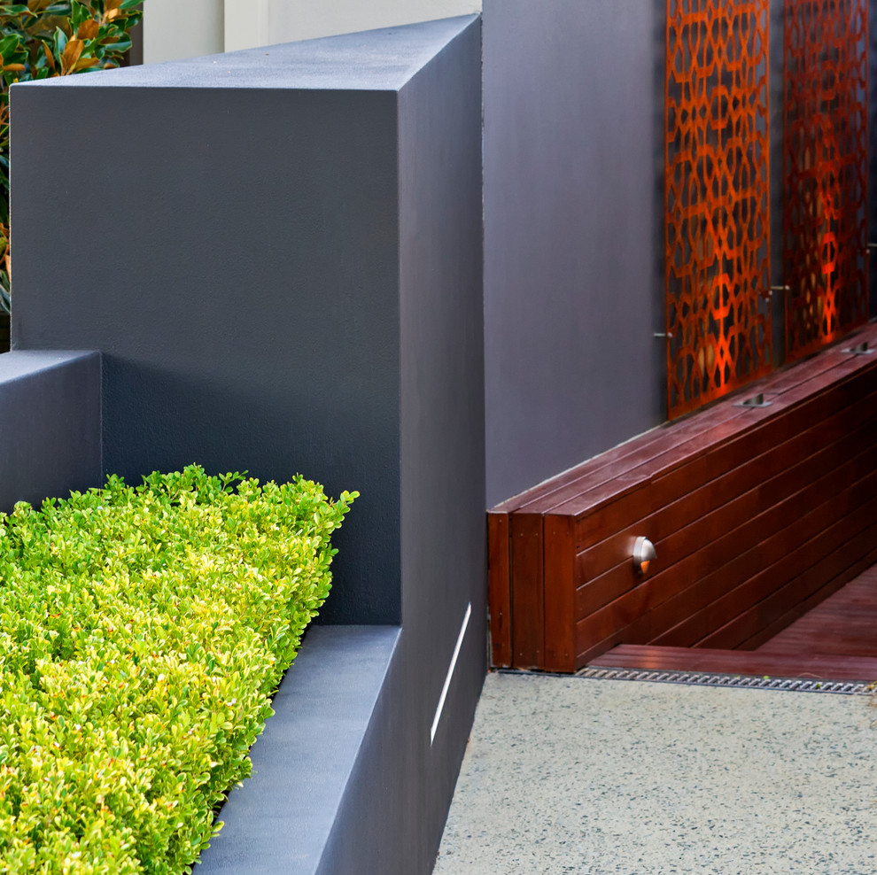 Design ideas for a small contemporary courtyard full sun garden in Perth with a water feature and decking.