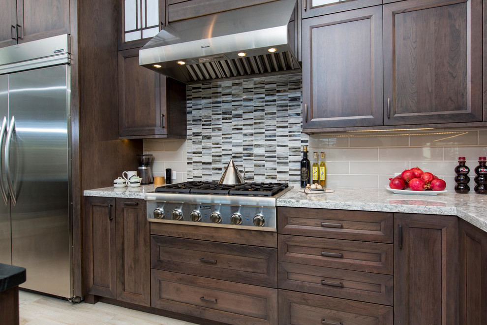 Example of a transitional kitchen design in Denver