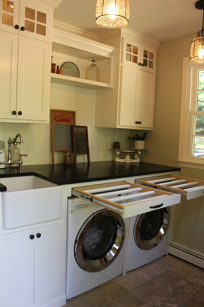Inspiration for a small cottage travertine floor and beige floor laundry room remodel in Philadelphia with a farmhouse sink, recessed-panel cabinets, white cabinets, soapstone countertops, green walls and a side-by-side washer/dryer