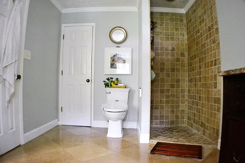 Mid-sized transitional master bathroom in Atlanta with an open shower, beige tile, stone tile, grey walls, travertine floors, dark wood cabinets, an alcove tub, a bidet, a drop-in sink and granite benchtops.