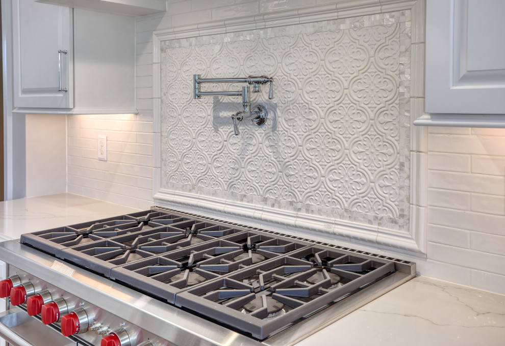 Transitional Kitchen with Two Toned Gathering Island & Archways