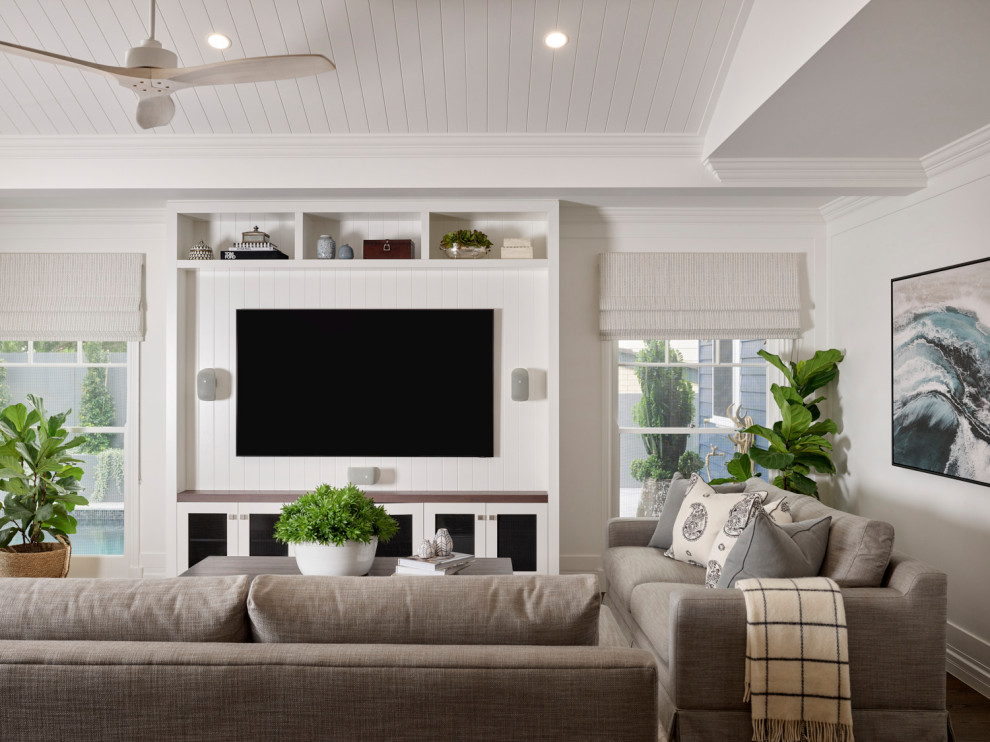 This is an example of a beach style living room in Brisbane.