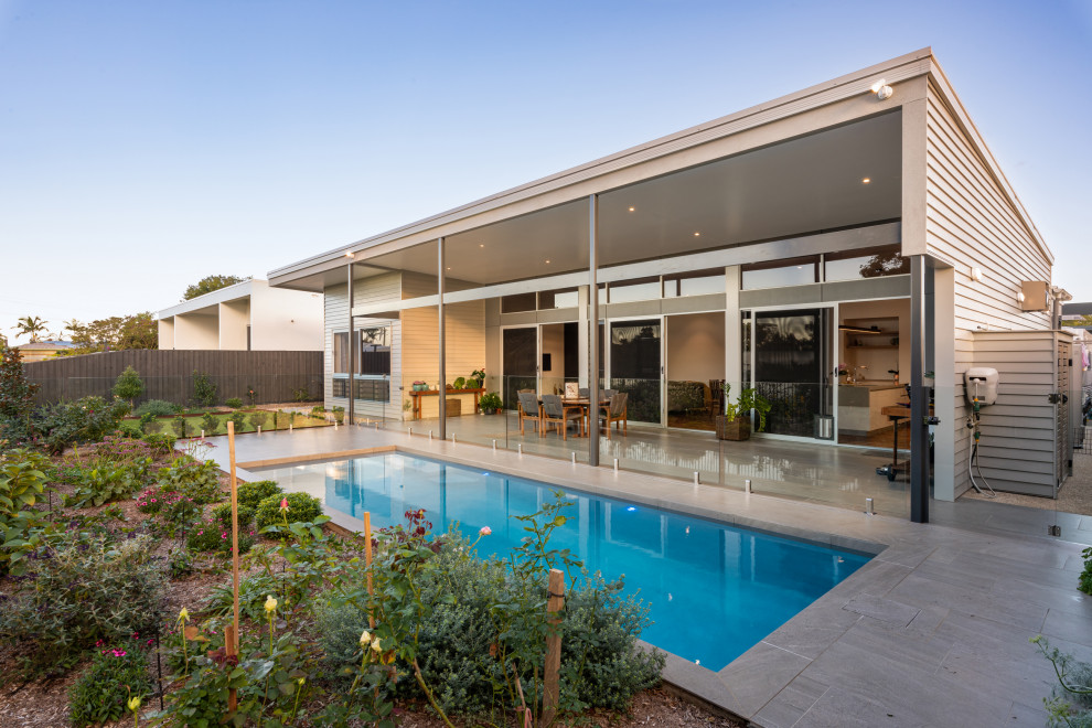 Inspiration for a contemporary rectangular pool in Sunshine Coast with tile.