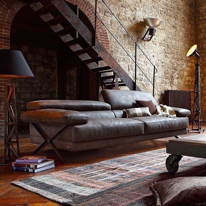 Inspiration for a large industrial formal enclosed living room in Ottawa with brown walls, dark hardwood floors, no fireplace, no tv and brown floor.