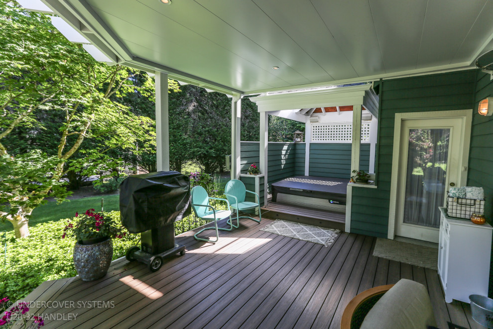 Mid-sized back porch photo in Seattle with a pergola