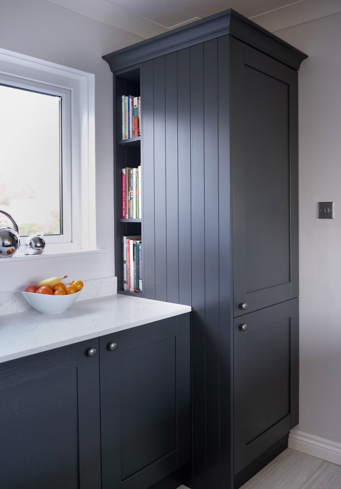 Design ideas for a mid-sized traditional u-shaped separate kitchen in Cornwall with a drop-in sink, shaker cabinets, grey cabinets, white splashback, linoleum floors, with island, grey floor and white benchtop.
