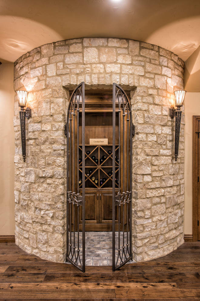 Design ideas for a small traditional wine cellar in Other with diamond bins and dark hardwood floors.
