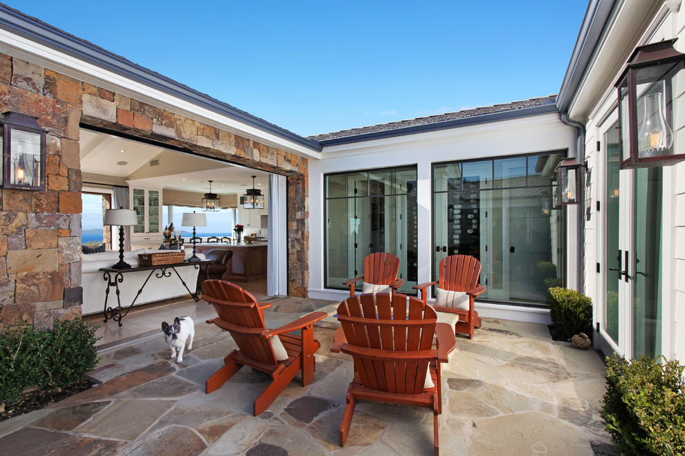 This is an example of a beach style courtyard patio in Orange County with no cover.
