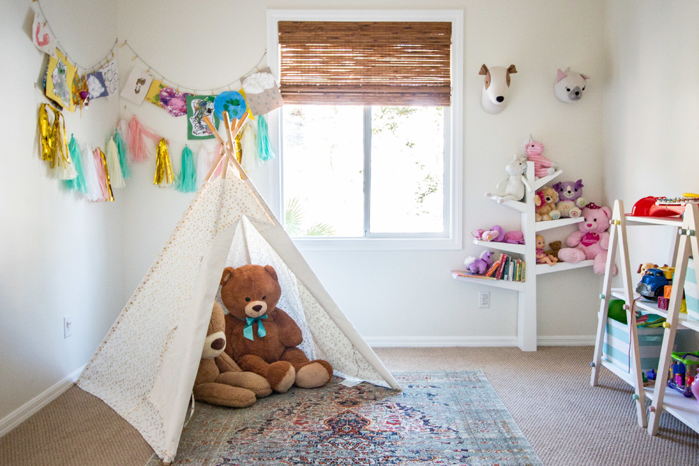 Inspiration for an eclectic kids' playroom for kids 4-10 years old and girls in Las Vegas with white walls, carpet and brown floor.