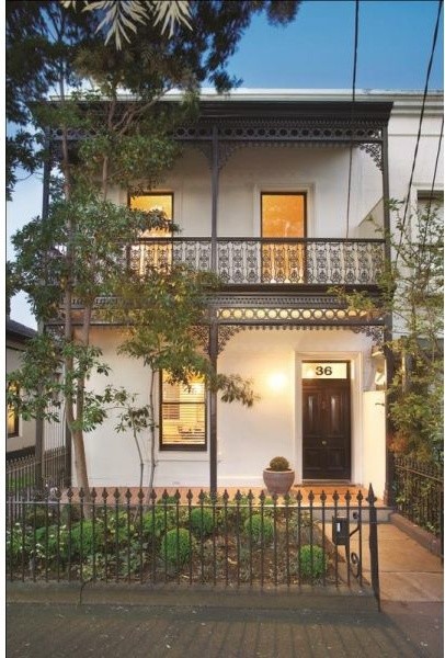 Inspiration for a mid-sized contemporary two-storey brick white exterior in Melbourne with a hip roof.