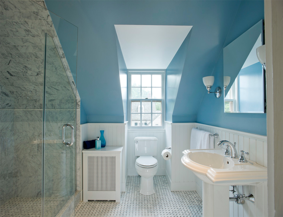 This is an example of a traditional bathroom in Baltimore with a pedestal sink, a two-piece toilet and gray tile.