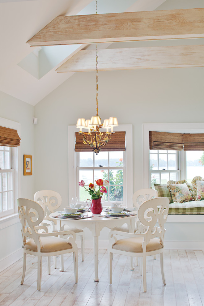 This is an example of a traditional dining room in Baltimore with grey walls, white floor and painted wood floors.