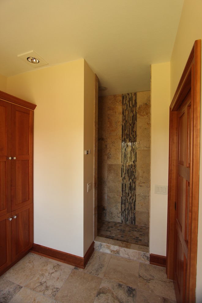 Photo of a mid-sized transitional 3/4 bathroom in Other with shaker cabinets, medium wood cabinets, an alcove shower, a two-piece toilet, brown tile, marble, yellow walls, marble floors, an undermount sink, engineered quartz benchtops, brown floor and an open shower.