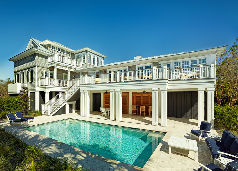 Photo of a mid-sized beach style three-storey blue exterior in Charleston.