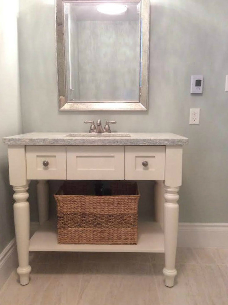Bathroom - mid-sized transitional ceramic tile bathroom idea with shaker cabinets, white cabinets, gray walls, an undermount sink and quartzite countertops