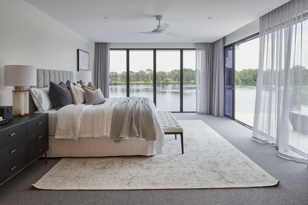 Photo of a transitional master bedroom in Gold Coast - Tweed with carpet and grey floor.