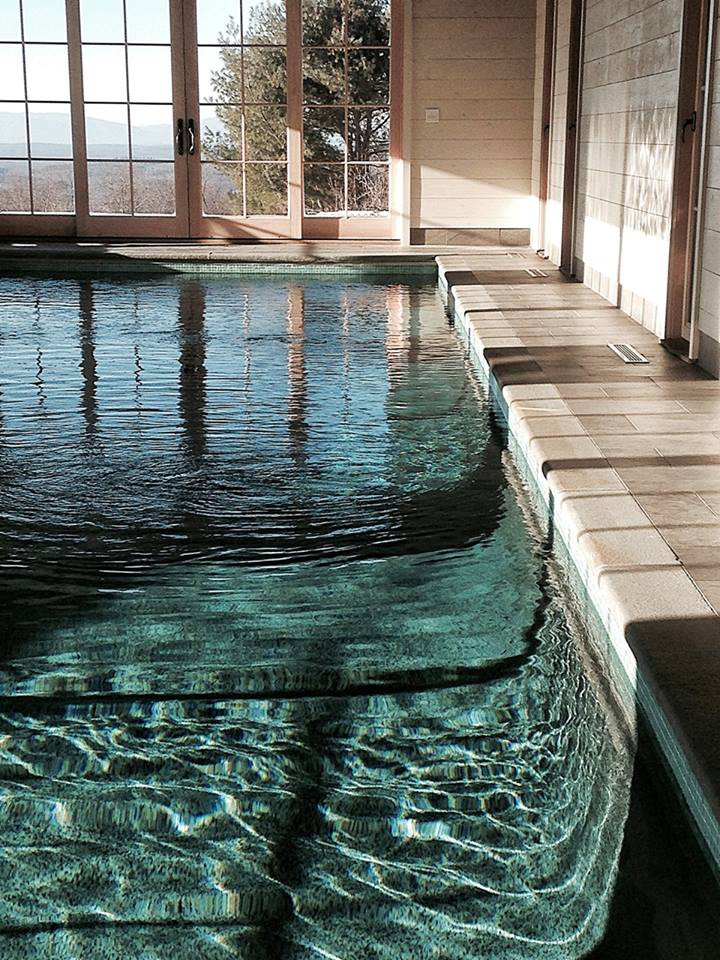 Photo of a mid-sized traditional indoor rectangular pool in New York.