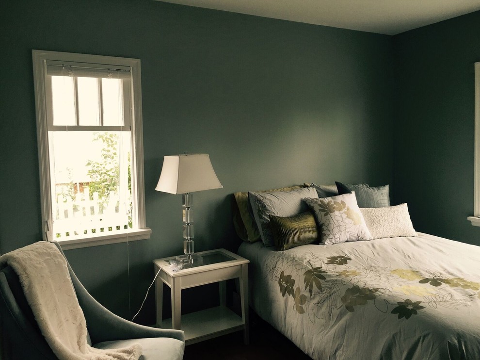 Inspiration for a mid-sized transitional guest bedroom remodel in Calgary with green walls and no fireplace