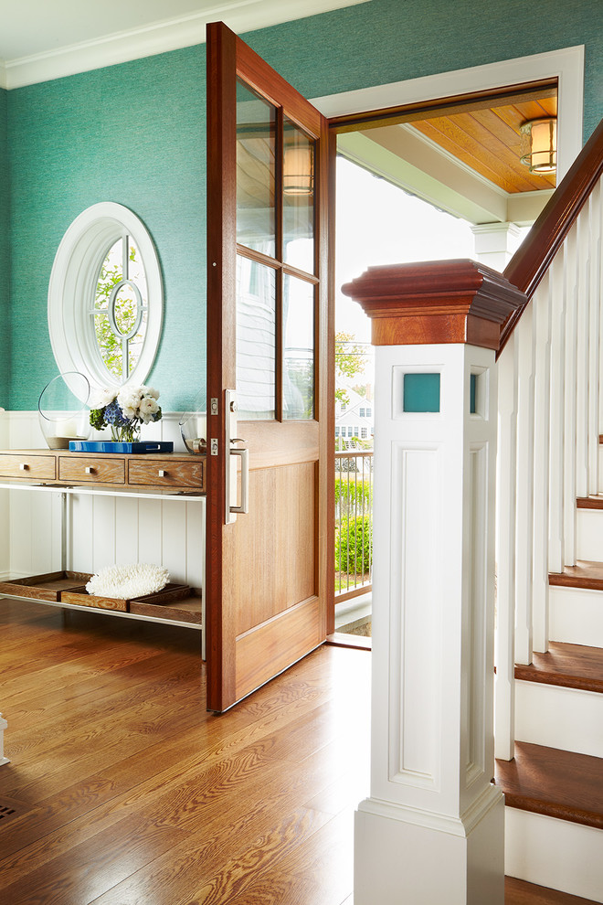 Mid-sized beach style foyer in New York with green walls, medium hardwood floors, a single front door, a medium wood front door and brown floor.