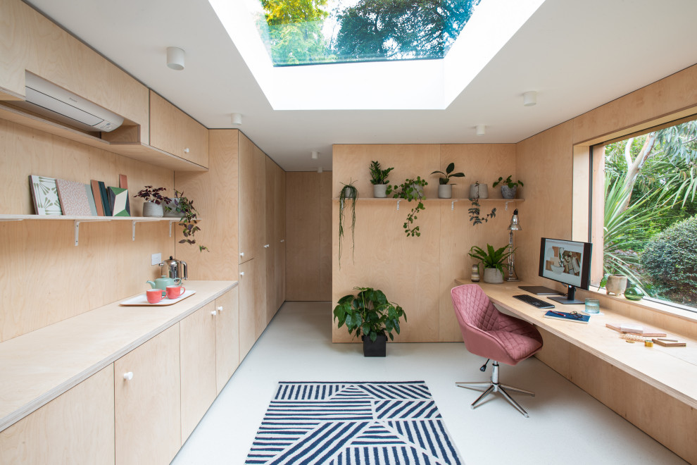 Photo of a scandinavian home office in London with panelled walls.
