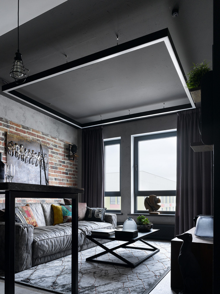 Design ideas for a mid-sized industrial open concept living room in Moscow with grey walls.