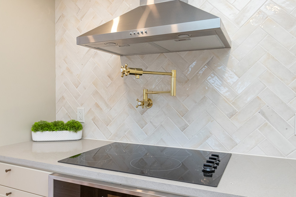 Example of a mid-sized transitional l-shaped medium tone wood floor, brown floor and coffered ceiling eat-in kitchen design with a farmhouse sink, raised-panel cabinets, gray cabinets, wood countertops, beige backsplash, ceramic backsplash, stainless steel appliances, an island and brown countertops