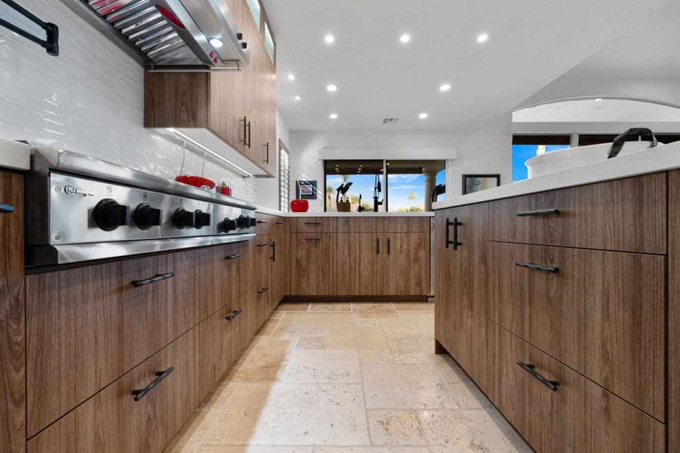 Enclosed kitchen - rustic l-shaped slate floor and beige floor enclosed kitchen idea with a single-bowl sink, flat-panel cabinets, medium tone wood cabinets, quartzite countertops, white backsplash, glass sheet backsplash, stainless steel appliances, a peninsula and white countertops