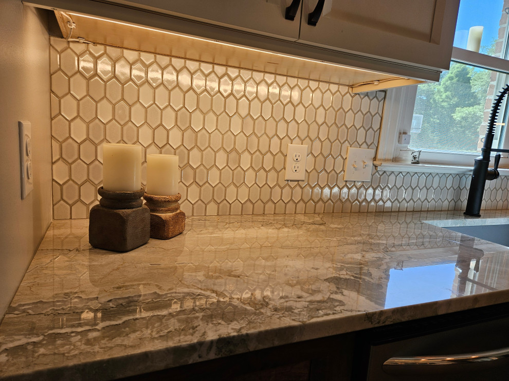 Inspiration for a mid-sized transitional eat-in kitchen remodel in Nashville with shaker cabinets and quartz countertops