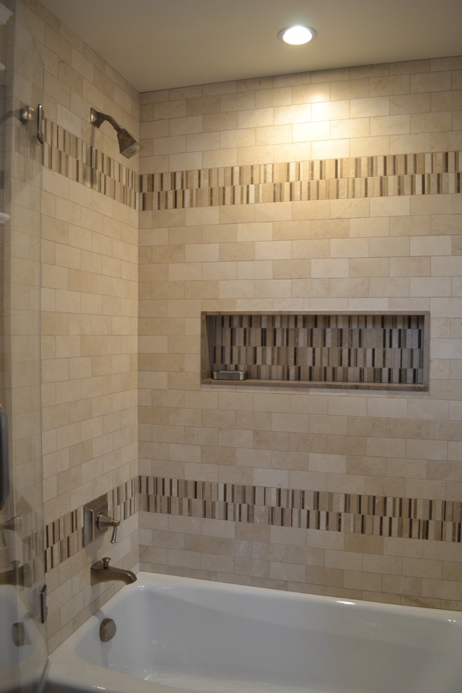 This is an example of a country bathroom in San Francisco with an alcove tub, a shower/bathtub combo, beige tile, stone tile, beige walls and porcelain floors.