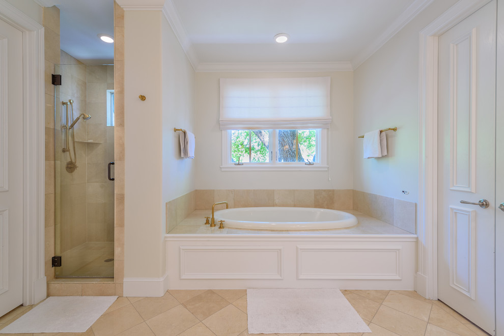 Photo of a large traditional master wet room bathroom in Dallas with flat-panel cabinets, white cabinets, a hot tub, a one-piece toilet, white walls, ceramic floors, an undermount sink, granite benchtops, beige floor, a hinged shower door and beige benchtops.