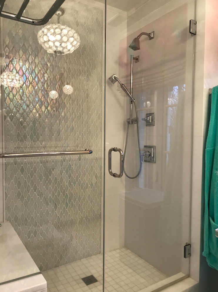 This is an example of an eclectic bathroom in DC Metro with white tile, ceramic tile, white walls, marble floors, white floor and a sliding shower screen.