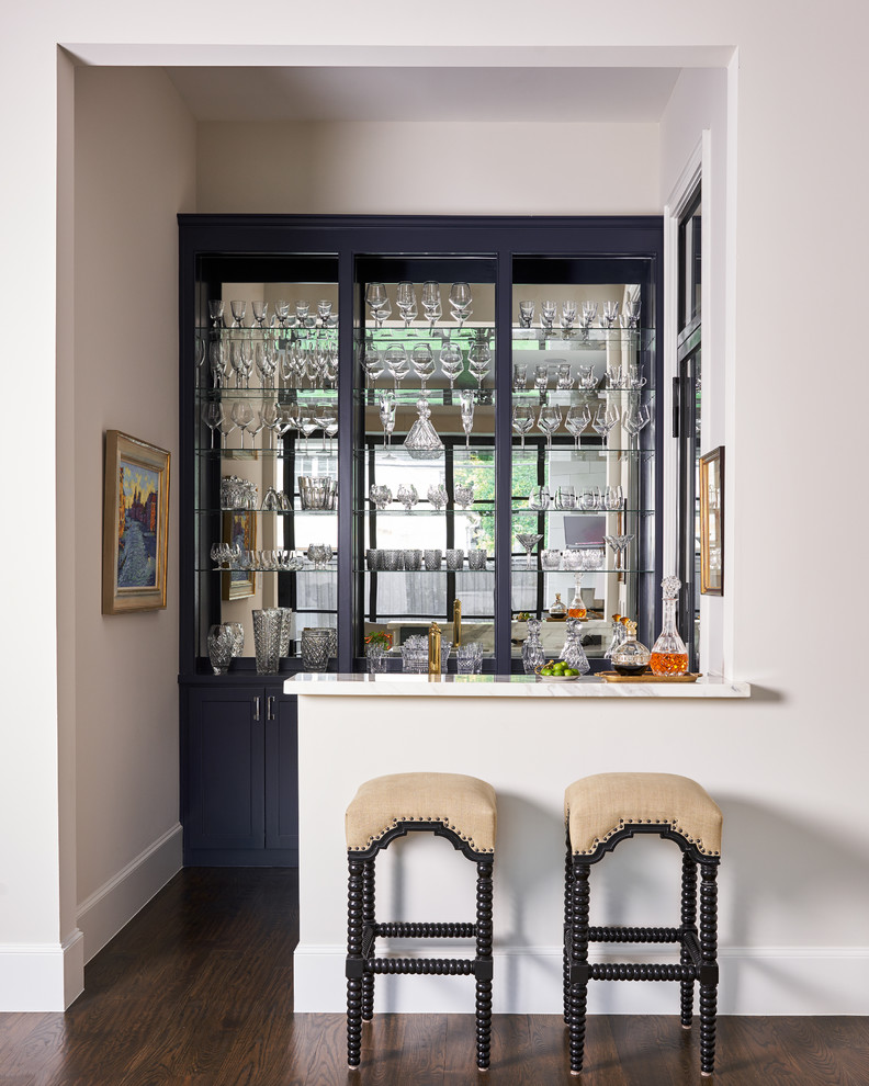 Home bar - transitional dark wood floor and brown floor home bar idea in Dallas with open cabinets and mirror backsplash