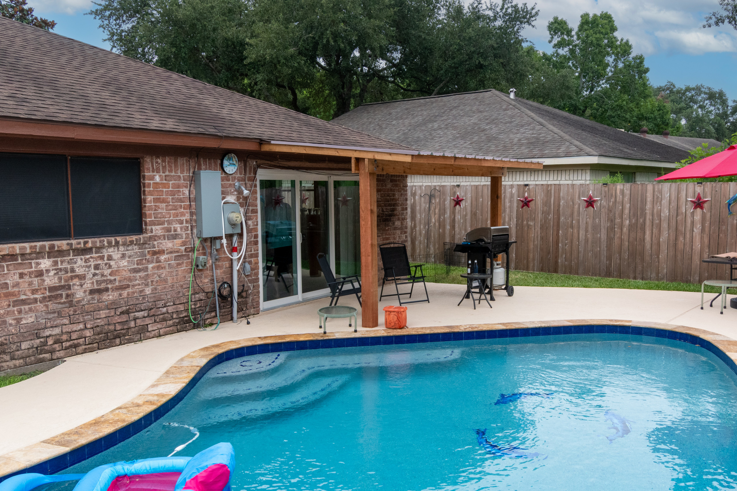 Custom Patio Cover Upgrade – Sealed Cedar & R-Panel Roofin