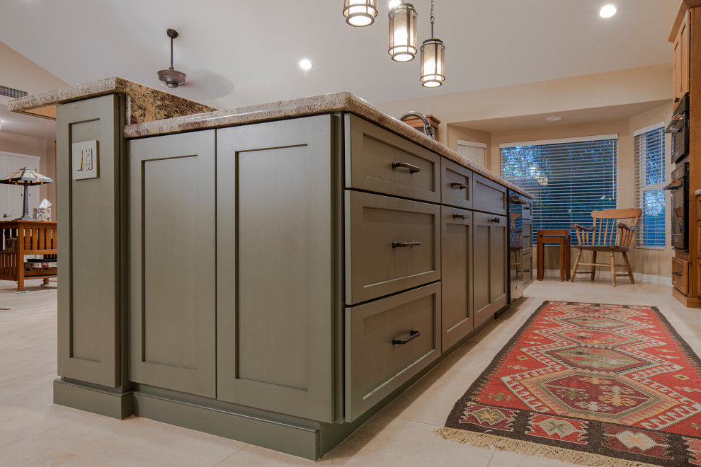 Large arts and crafts galley eat-in kitchen in Phoenix with a double-bowl sink, shaker cabinets, medium wood cabinets, granite benchtops, red splashback, ceramic splashback, black appliances, porcelain floors, with island, beige floor and green benchtop.