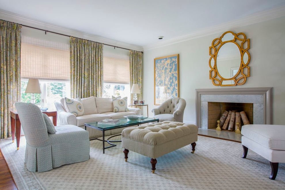 Photo of a mid-sized transitional formal living room in DC Metro with medium hardwood floors and a standard fireplace.